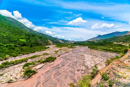 Dry mud river in between Colorfull mountains at the Parque Nacional Los Cardones (National Park) in the Salta Provence , Argentinaの写真素材