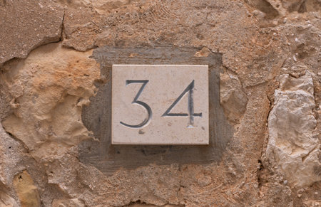House number 34 in old Roman styleの写真素材