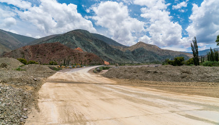 Roadwork and Colorfull mountains at the Parque Nacional Los Cardones (National Park) in the Salta Provence , Argentinaの写真素材