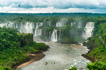 Iguazu Falls seen from the Brazilian side with tourist boat on small lakeの写真素材