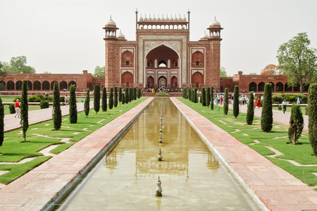AGRA, INDIA - APRIL 23, 2007: Unidentified people in front of Taj Mahal gateway in Agra, India. It was built by Mughal emperor Shah Jahan in memory of his third wife, Mumtaz Mahal and was opened at 1648.のeditorial素材