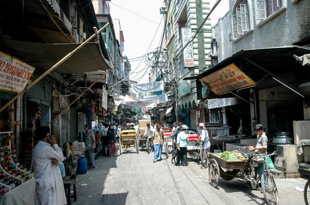 NEW DELHI, INDIA - APRIL 21, 2007: Unidentified people on the street of New Delhi, India. With a population of 22 million in 2011, Delhi metropolitan region is world's fifth most populous.のeditorial素材