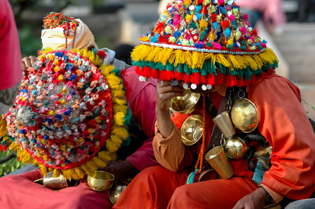 CASABLANCA, MOROCCO - APRIL 25, 2006: Unidentified water sellers on the street of Casablanca, Morocco. Water sellers are dressed in colorful dress, ringing brass bells and offers water from his traditional leather pouch.のeditorial素材