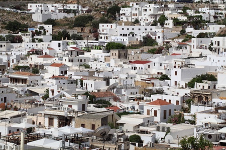 View down on to the pretty white buildings of Lindos on the Island Of Rhodes Greeceの写真素材