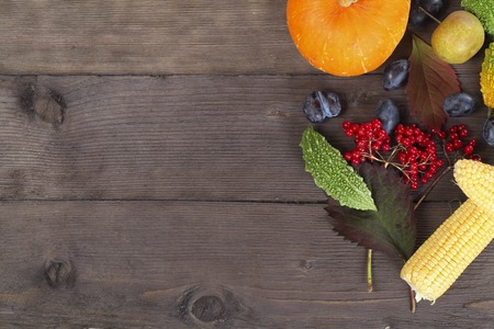 Fruit background. Fresh organic fruit, vegetable and berry on old wood. Autumn harvest