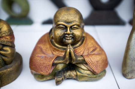 Golden Buddha figurine Ubud, Bali, Indonesiaの写真素材