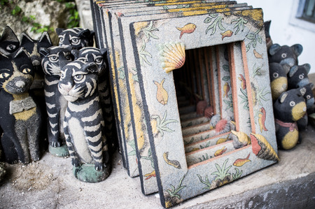 Carved Wooden Souvenir Cats and frame in village Mas Bali Indonesia