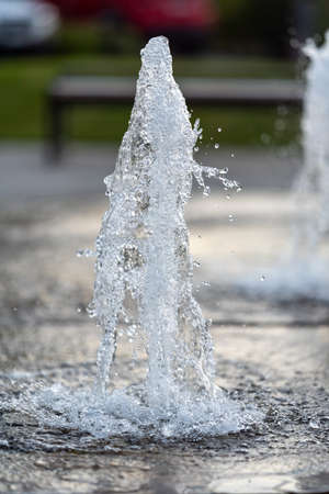 frozen spray, visible drops of water in the air. Fountain from undergroundの写真素材