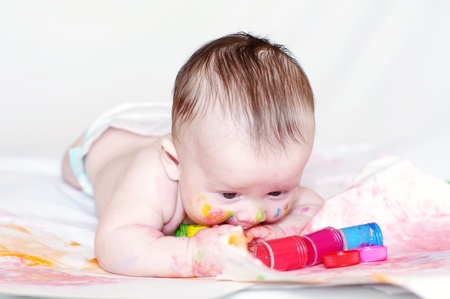 The baby draws finger-type paints (4 months) の写真素材