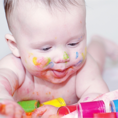 The baby draws finger-type paints  4 months  の写真素材