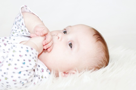 Portrait of the thoughtful five-months baby