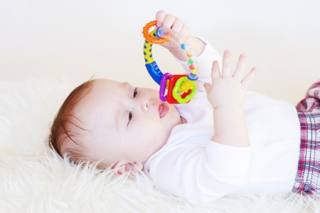 The baby with a rattleの写真素材