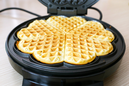 Preparing homemade waffles in the kitchenの写真素材