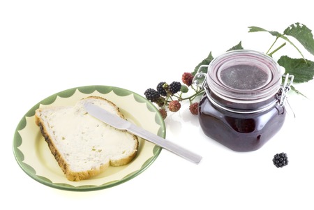 a slice of bread ready for blackberry jam