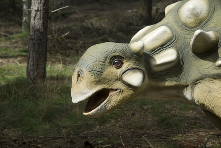 Head of a green dinosaur looks like a turtleの写真素材