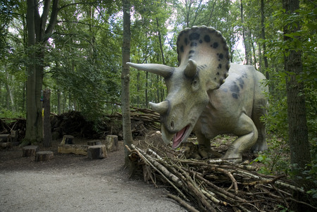 Eating prehistoric dinosaur in the forestの写真素材