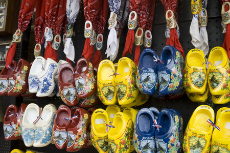 a wall full of painted wooden shoes from Holland