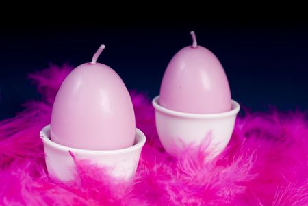 pink easter eggs on feathersの写真素材
