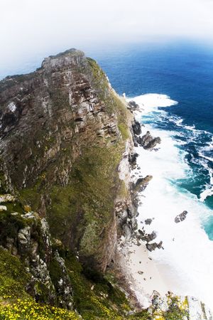 coastline with high rocks at South Africaの写真素材
