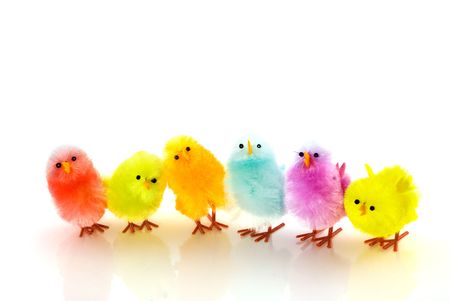 many colored easter chickens in a rowの写真素材