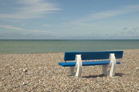 relaxing by the beach at the benchの写真素材