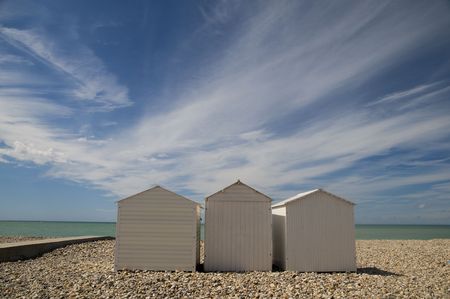 tranquil beach with little housesの写真素材