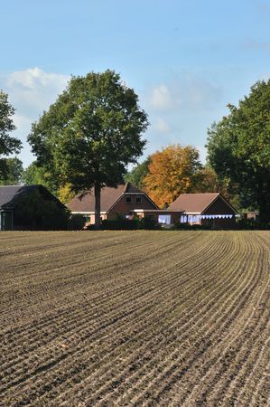 Traditional farmhouse with laundry hanging outdoorの写真素材