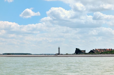 Lighthouse on a island at the coast from Normandyの写真素材