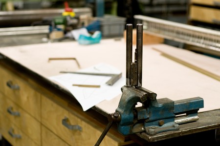 Metal clamp at the drawing table