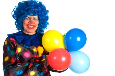 Clown with blue hair and colorful balloonsの写真素材