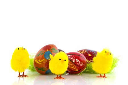 Colorful painted easter eggs and yellow chicks