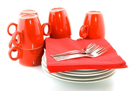 red mugs and saucers for fancy cakesの写真素材