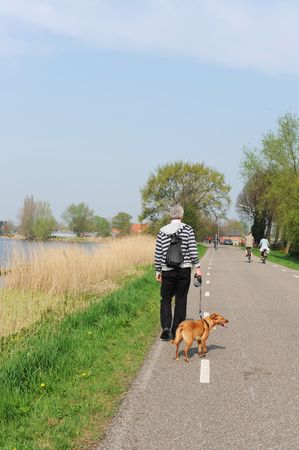 Walking the dog active outdoor の写真素材