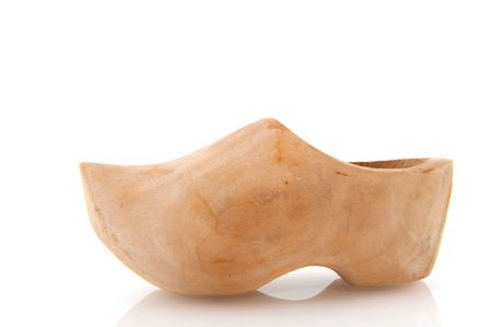 Traditional Dutch wooden shoe isolated over white