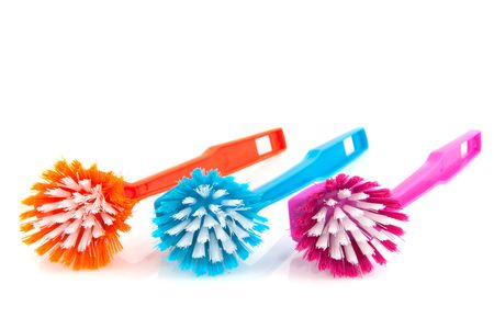 Colorful plastic brushes for washing the dishesの写真素材