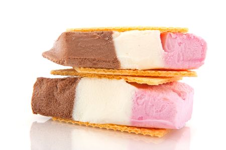 Ice cream in three colors with wafflesの写真素材
