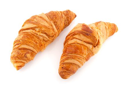 French bread rolls croissants isolated over whiteの写真素材