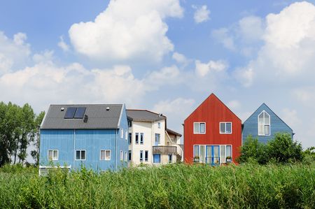 Energy saving houses with solar cells on the roofの写真素材