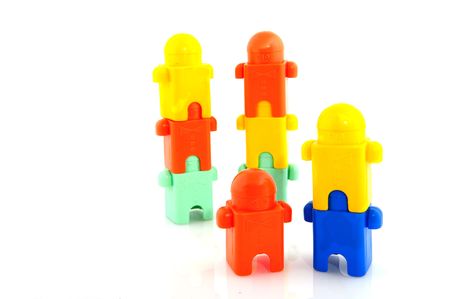 colorful acrobats climbing to towers isolated over whiteの写真素材