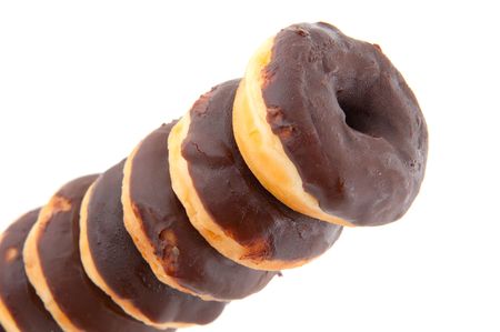 Several tasty chocolate donuts isolated over whiteの写真素材