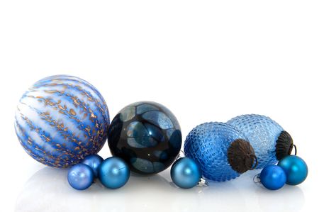 Blue christmas balls in different sizes isolated over whiteの写真素材