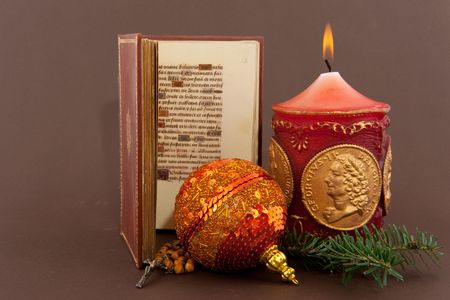christmas candle and decoration with open bibleの写真素材