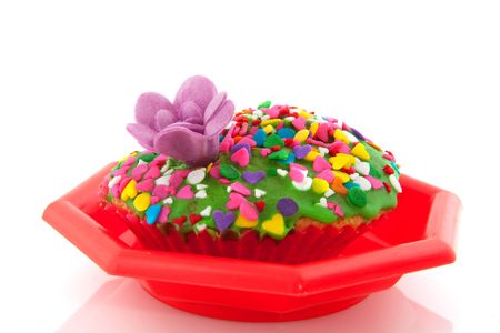 fancy colorful cake with candle isolated over whiteの写真素材