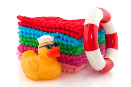 Folded colorful towels with poolside  isolated over whiteの写真素材