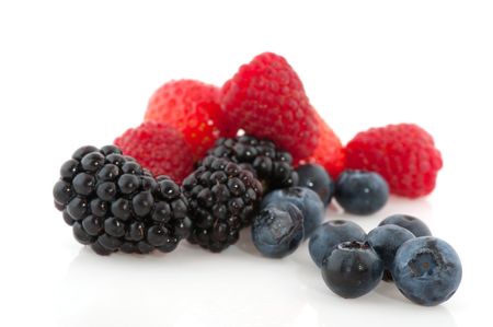 blackberries and strawberries in close up isolated over whiteの写真素材