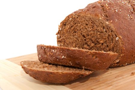 Fresh whole meal bread on a timber