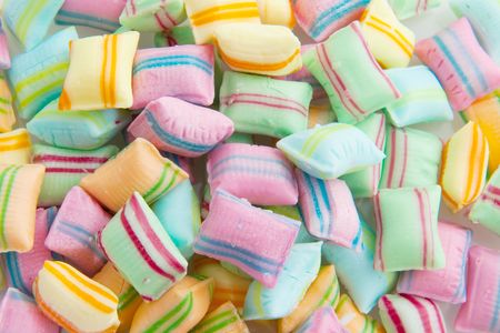 candy pillows in many colors filled as background