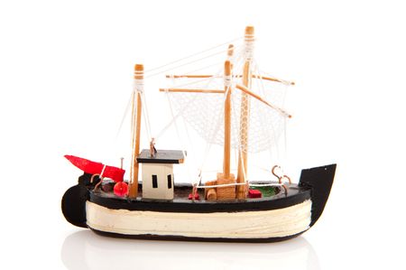 Old wooden fishing boat isolated over whiteの写真素材