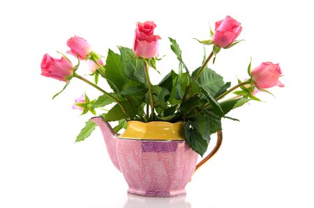 Pink bouquet roses in cheerful romantic tea potの写真素材