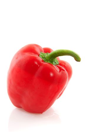 Whole tasty red paprika isolated over whiteの写真素材